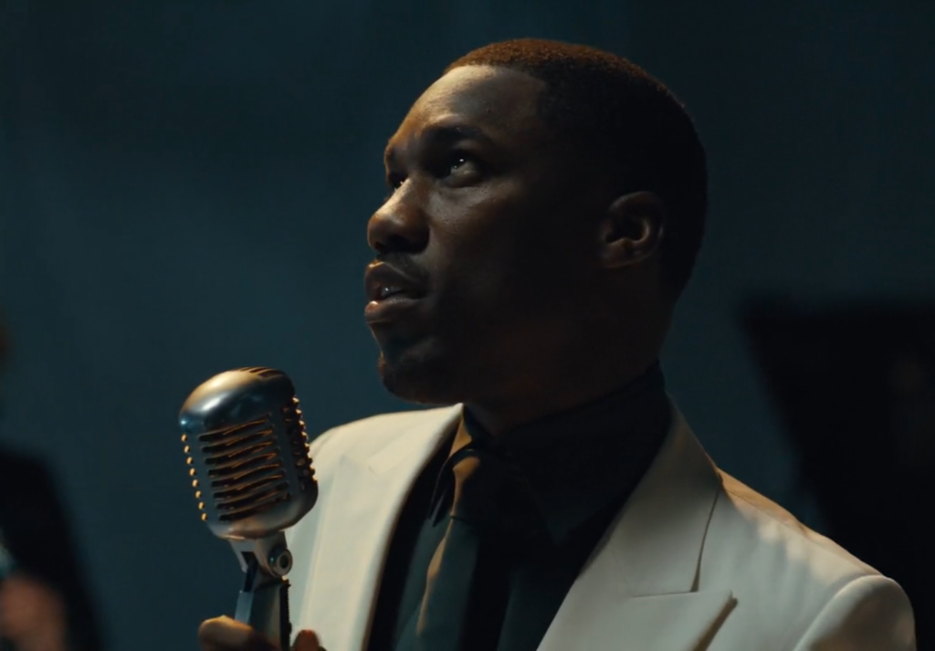 Givēon, wearing a white blazer, in his "Twenties" music video.