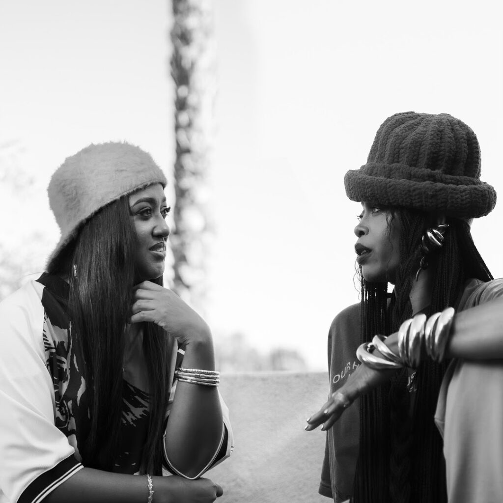 A black and white photo of rapper Rapsody and singer Erykah Badu