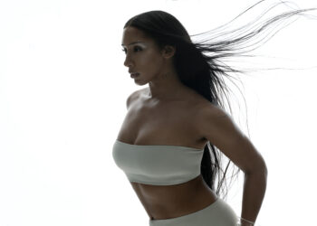 A photo of singer Naomi Sharon against a white backdrop.