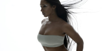 A photo of singer Naomi Sharon against a white backdrop.