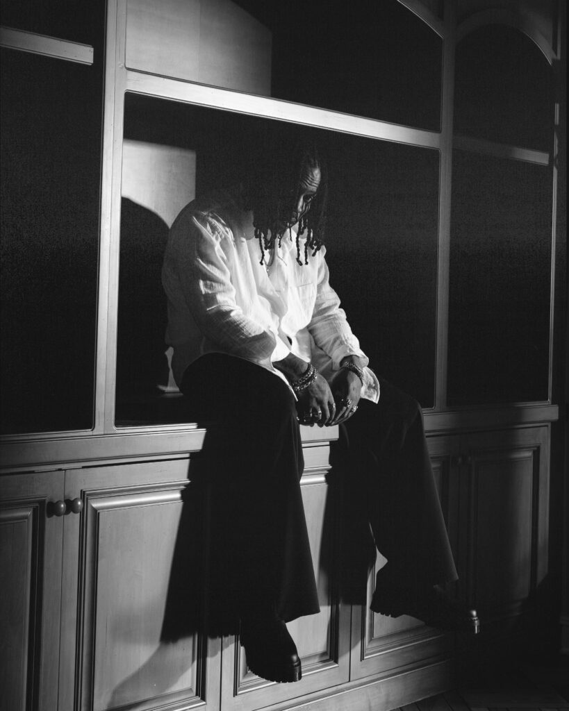 A black and white photo of singer SiR