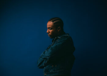 A photo of Ebubé against a blue backdrop