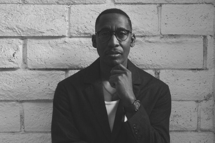 A black and white photo of singer Raphael Saadiq