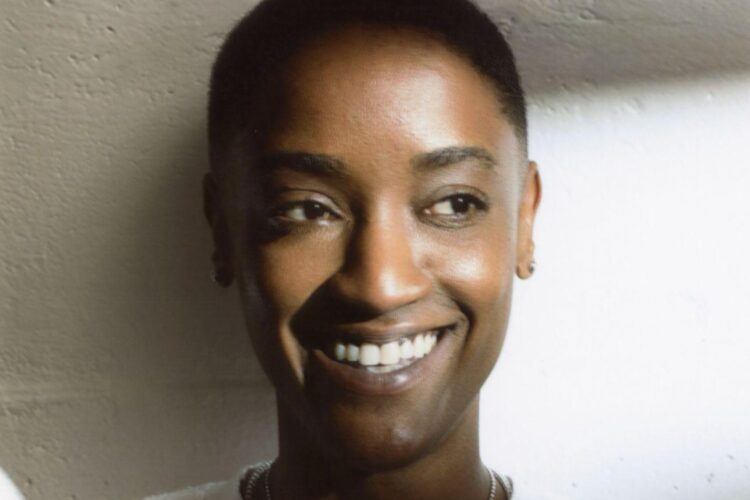 A photo of singer Syd smiling